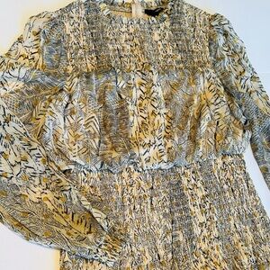 This cute size large dress with long sleeve and ruffled skirt.